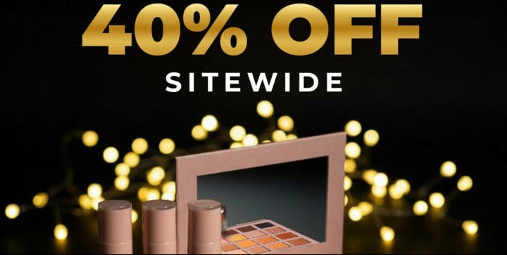 Makeup products with a '40% OFF SITEwide' offer on a dark background with lights.