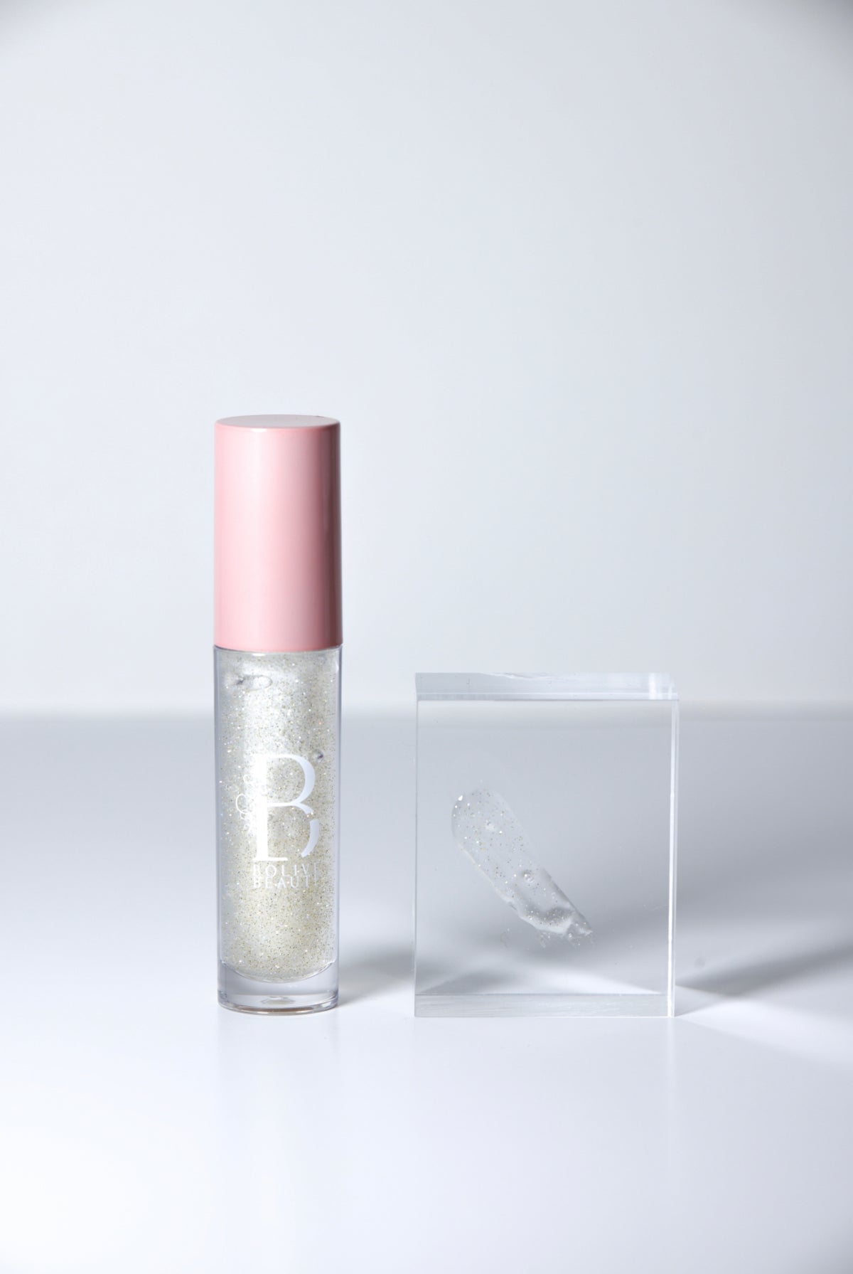 Soft Life clear shimmer lip gloss topper by Bolive Beauté