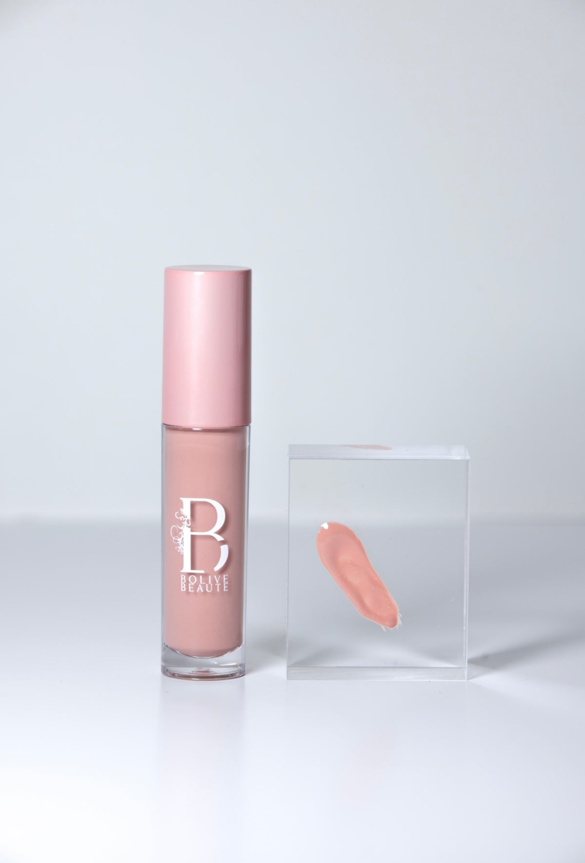 She's So Flirty light nude pink lip gloss by Bolive Beauté