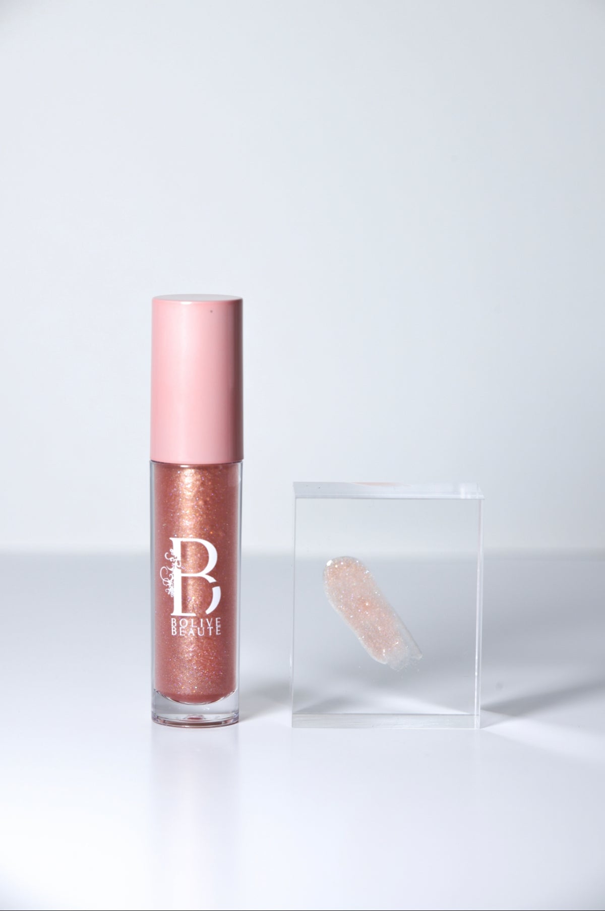 MVP rose gold shimmer lip gloss by Bolive Beauté